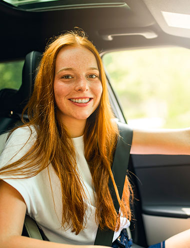 Young teen in new car.