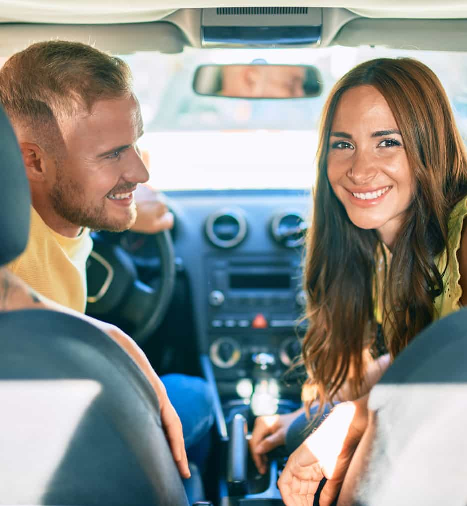 Young couple in car.